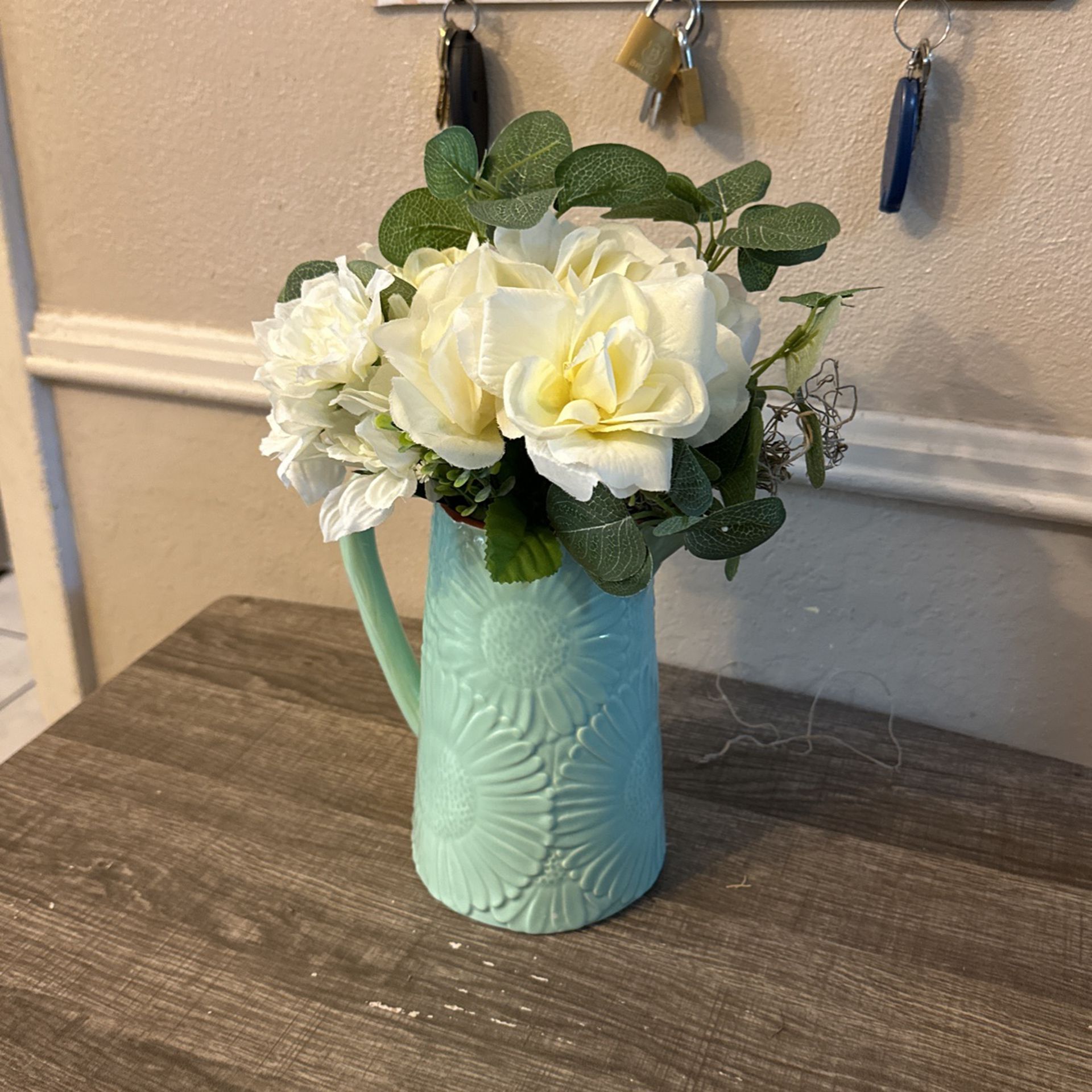 Teal Green Vase With Off White Flowers And Roses 