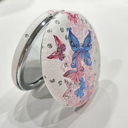 Carry a touch of enchantment in your purse with our Butterfly Dreams Compact Mirror