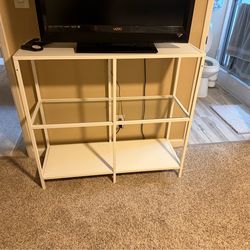 White TV stand with glass shelf