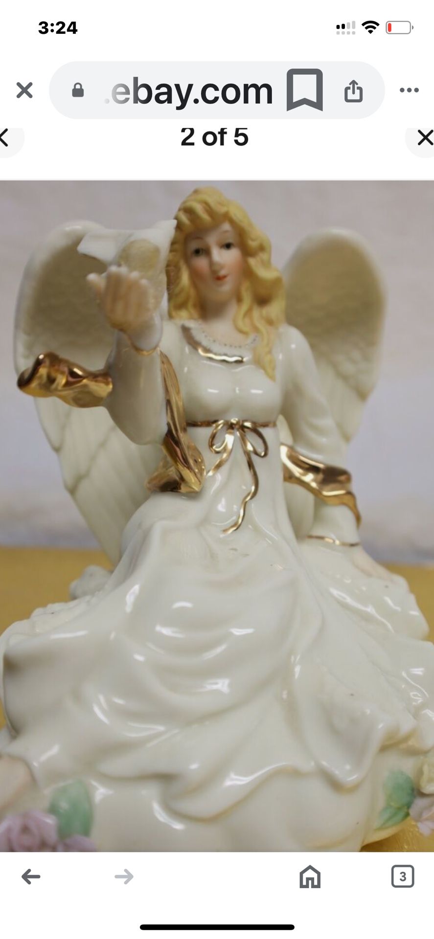 7" Porcelain Angel figurine HOLDING a White Dove. Sings "Evergreen"