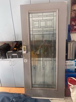 Nice modern front door with thick glass . Can paint any color