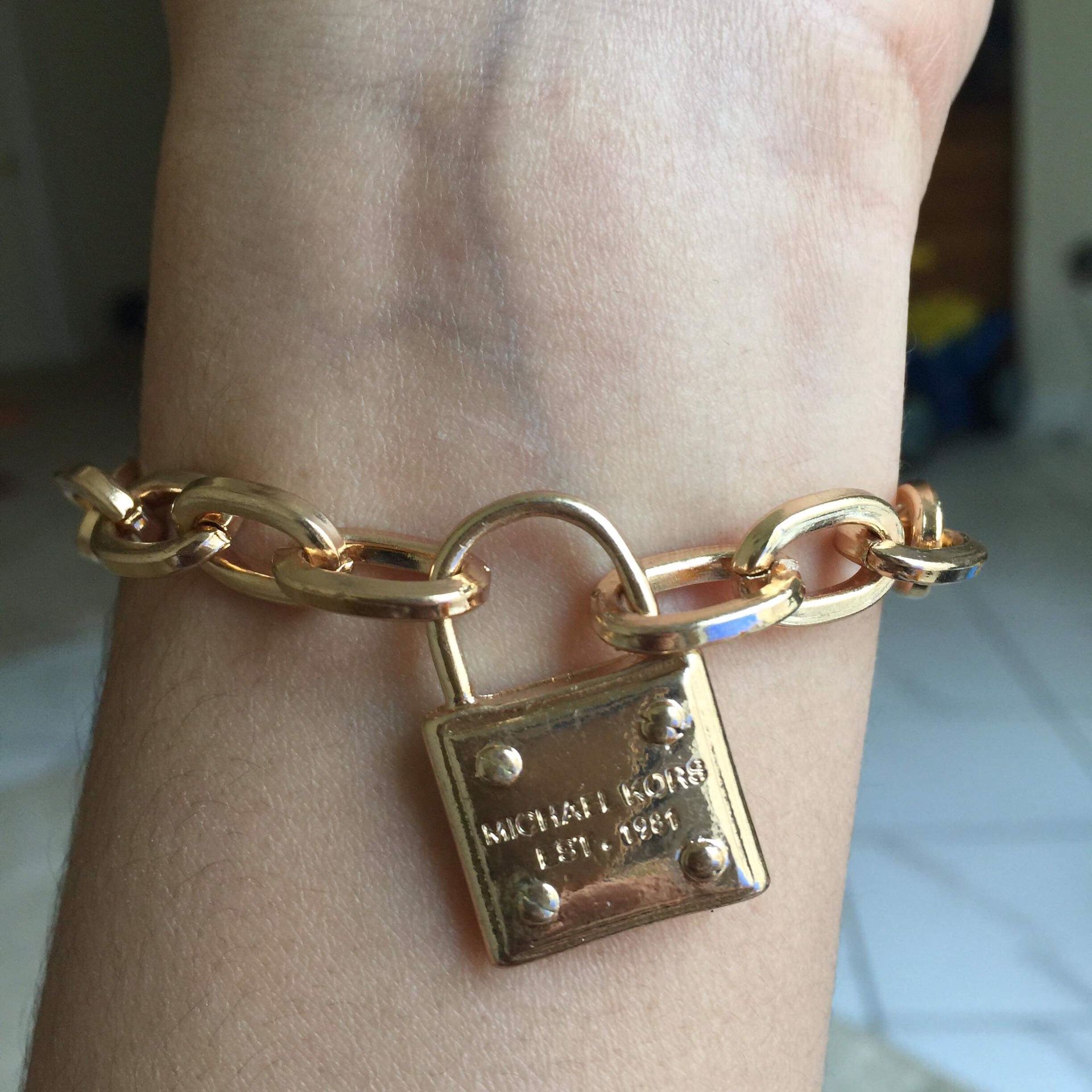 Mk Michael kors padlock gold tone bracelet