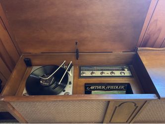 Vintage record player in console cabinet