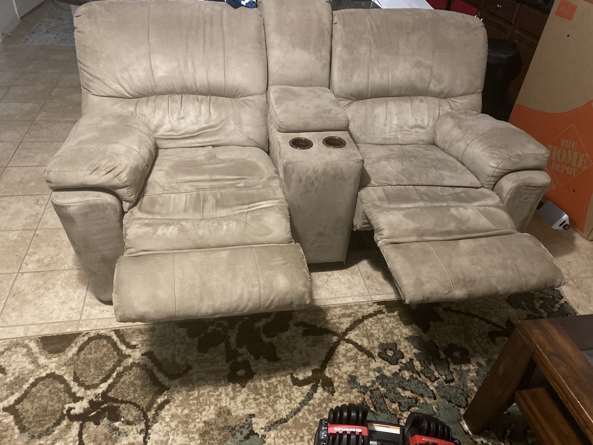 Sectional couch with four recliners and cupholders