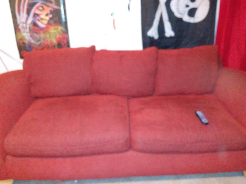 Comfy red couch must go now