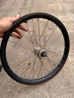 20 inch front bicycle wheel with disc brake hub.