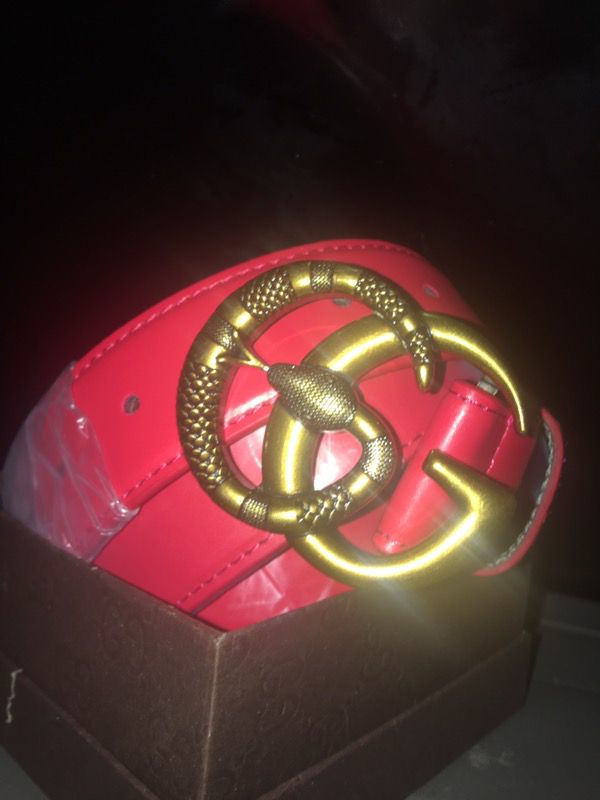 Red Gucci belt with snake buckle