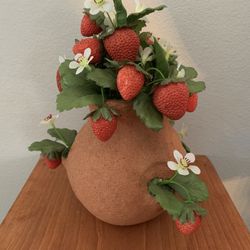 Faux Strawberry plant in faux terra cotta planter All items are sold as is