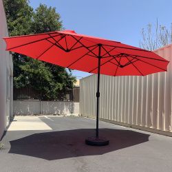 $115 (New) Large 15ft double sided outdoor umbrella w/ 65 lbs plastic weight base (red/gray) 