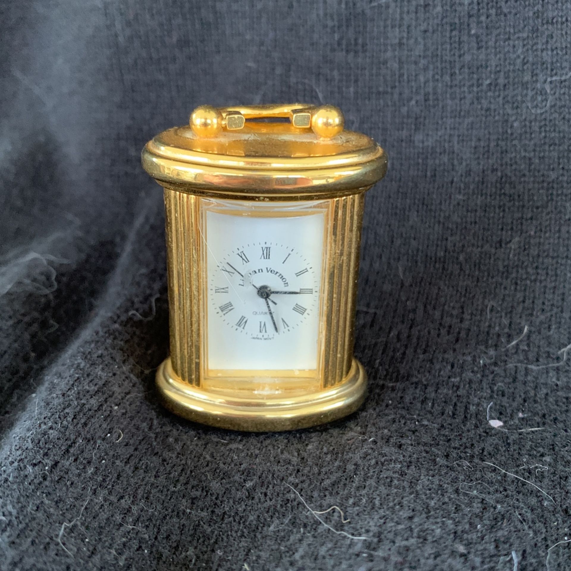 Miniature brass clock