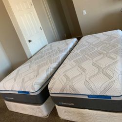 2 TWIN XL SEALY POSTUREPEDIC MATTRESSES AND FREE BOX SPRINGS 