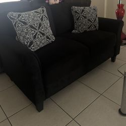 Black Couch with Pattern Pillows