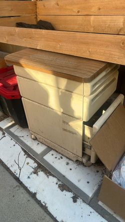 Metal Following Cabinet With Three Drawers And Wooden Top