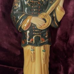 Chinese Man Playing Instrument 