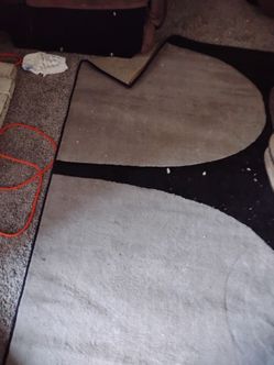 Grey in black rug