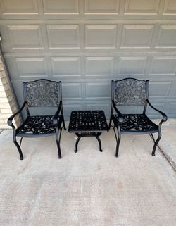 Patio set. Chairs and a table. Very nice condition. All metal.