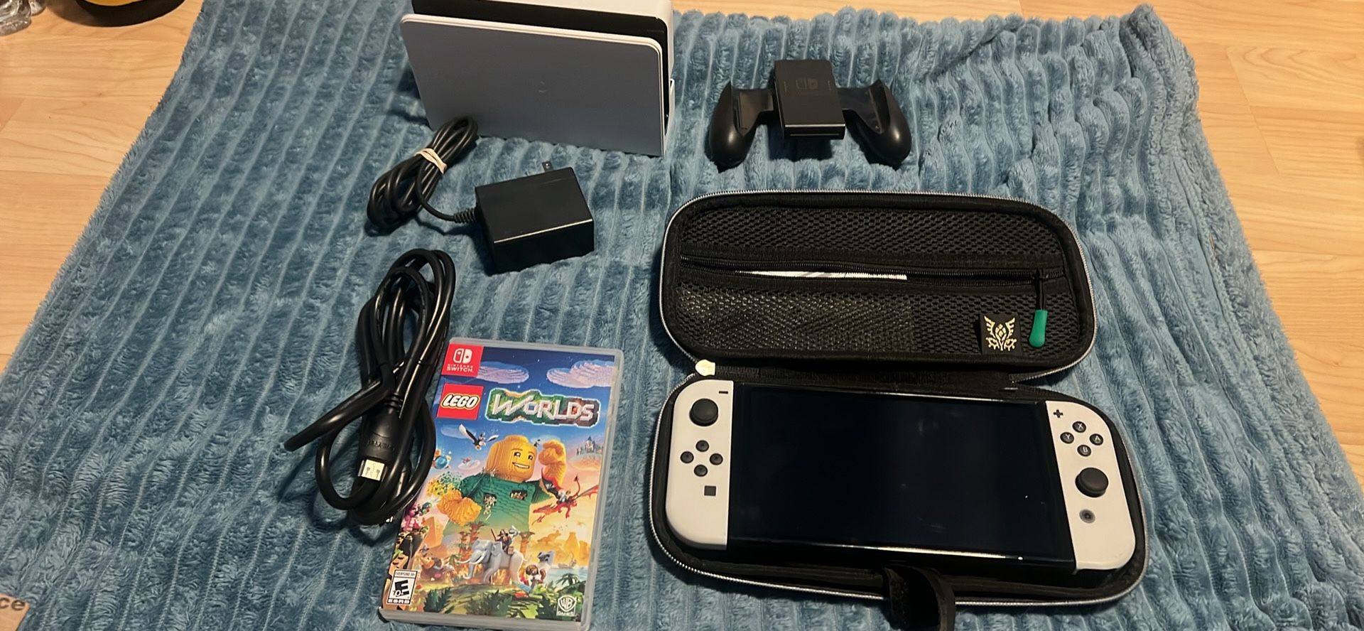 NINTENDO SWITCH OLED WITH DOCKING STATION, LEGO WORLDS, JOYCON GRIP, HDMI AND ZELDA CASE 