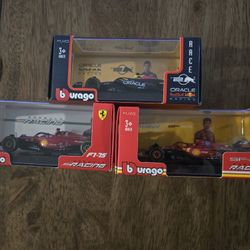 Burago F1 Formula 1 Race Cars 1/43 Ferrari And Red Bull Oracle