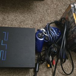 Playstation 2/Ps2 (With games, power cord, Av cables, games and a memory card)