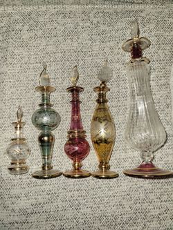 Multiple vintage perfume bottles