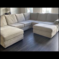 Beautiful tan three-piece with storage Ottoman