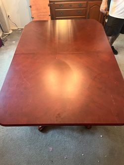 Nice solid wood dining table with 2 inserts and six chairs