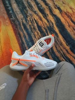 White Jordan basketball shoes.