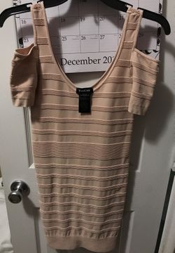 Bebe Petite/Sm stretchy dress. Color nude. Fits above the knee.