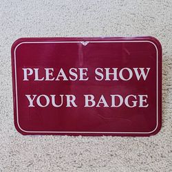 Please Show Your Badge desk table counter desktop tabletop countertop lobby entryway greeting sign