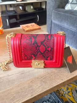 Red designer purse with buckle