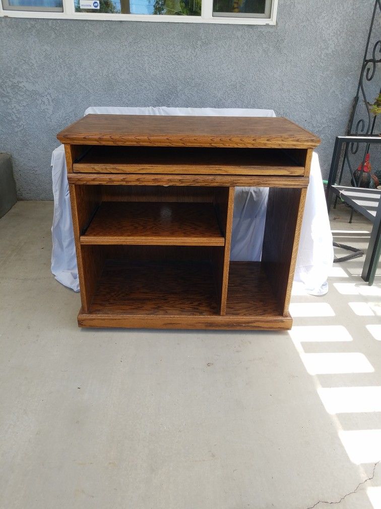 Solid Oak Computer Desk. 23 1/2" Wide, 19" Deep, 31"Tall. Nice Condition. Has Wheels Rolls Good.