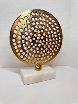 Imperia Perforated Gold Disc Sculpture on a White Marble Pedestal Base
