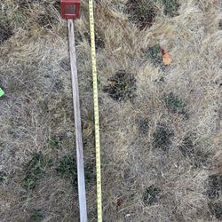 Tall wooden red Birdfeeder On Tall Post