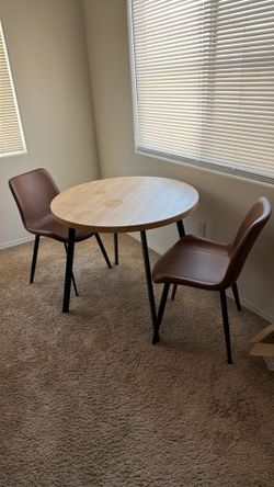 Table and leather chairs