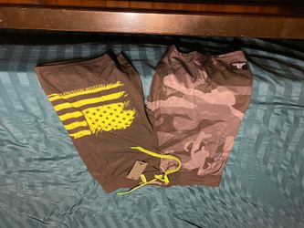 Men size 34” FREEDOM INDUSTRIES swim short. Back pocket as well as front pockets. Brand new never worn...