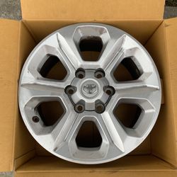 Four Toyota Tacoma 17” wheels. 