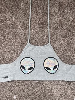 Gray halter crop top with holographic alien face graphic.