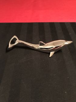 Vintage dolphin figure bottlecap opener. Silversmith studios