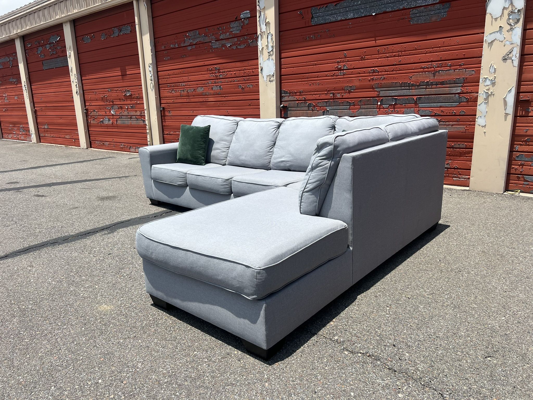 Ashley’s Gray Sectional Sofa Couch with right facing chaise
