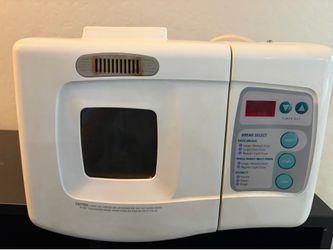 Black & Decker All In One Deluxe bread maker, model #B1800, featuring a white exterior and a front-facing digital control panel.