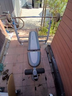 Bar and base, for exercise