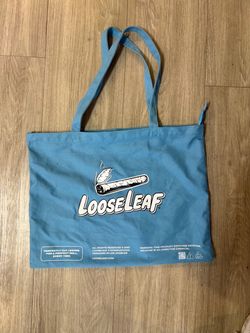 ALOCS X LOOSE LEAF BUNDLE W/ LOOSE LEAF TOTE BAG, 2 CLASSIC ALOCS SHIRTS, LOOSE LEAF HAT, LOOSE LEAF PRODUCTS. ALL MERCHANDISE LISTED AS BUNDLE