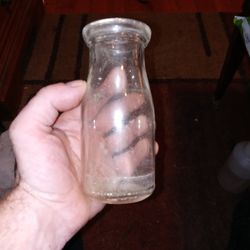 Small vintage glass milk bottle