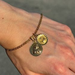 18k solid yellow gold 7” bracelet & two 14k yellow gold Jesus charms/ pendants