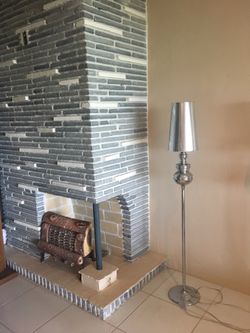 Floor lamp. New in box. Available in gold or silver