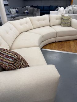Cream Curved Sectional Sofa with Tufted Back