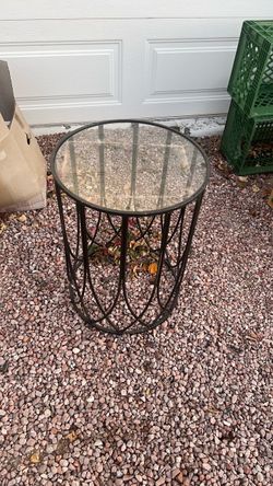 Decorative glass and rod iron table