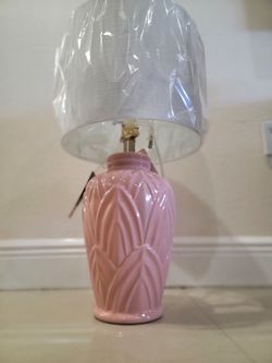 Decorative table lamp featuring a pastel pink ceramic base with a textured leaf or petal relief design; manufactured by StyleCraft exclusively for JCP