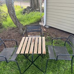Table And Three Chairs 
