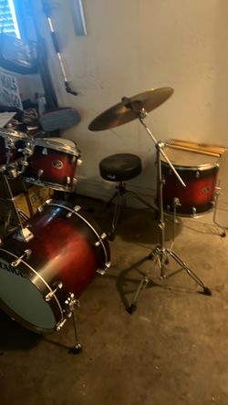 Red and black Full tama drum set with 10 drum stick included